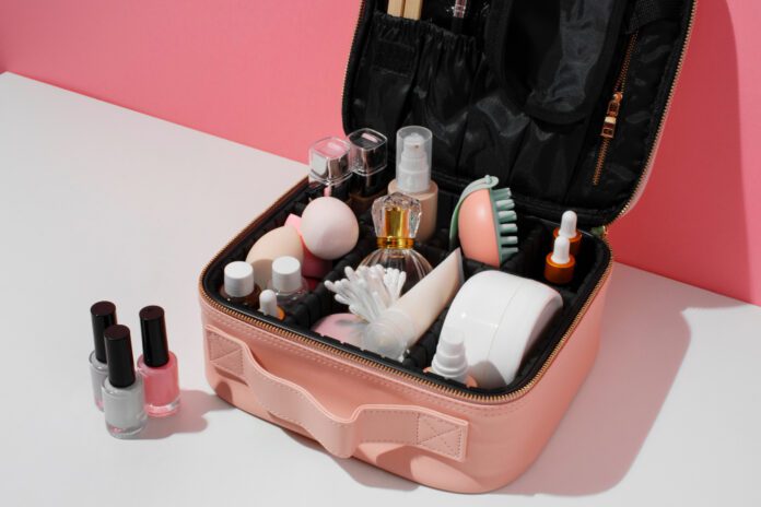 A stylish makeup organizer with clear acrylic compartments holding various beauty products on a neat vanity.