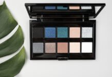 Best Eyeshadows for Blue Eyes: A Comprehensive Guide to Enhancing Your Natural Gaze Blue‑eyed woman applying the best eyeshadows for blue eyes from a flattering color palette